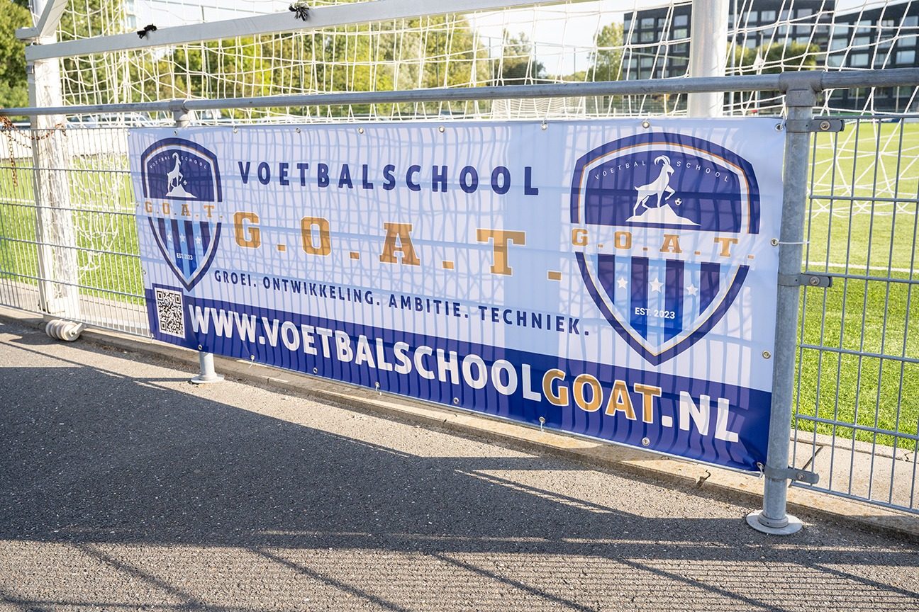G.O.A.T. branded banner
